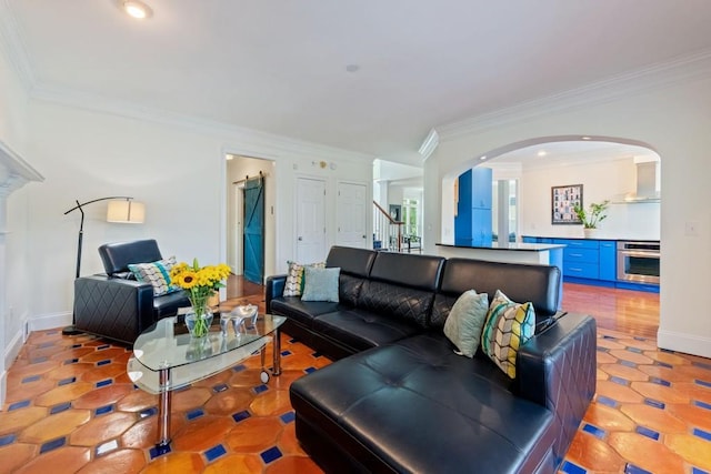 living area featuring baseboards, stairs, arched walkways, and ornamental molding