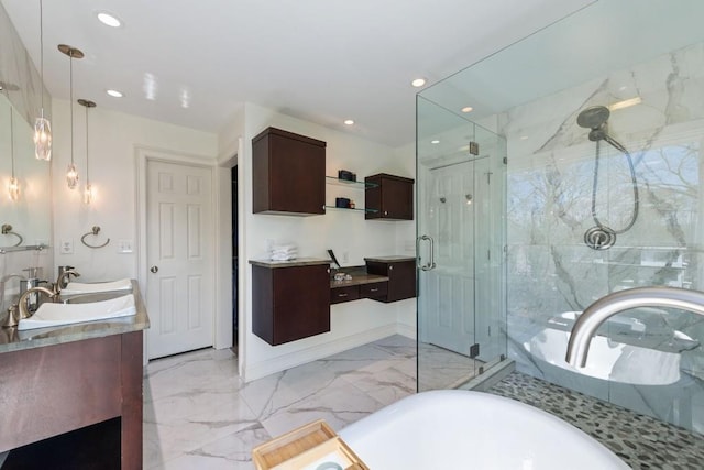 full bathroom with recessed lighting, marble finish floor, vanity, and a shower stall