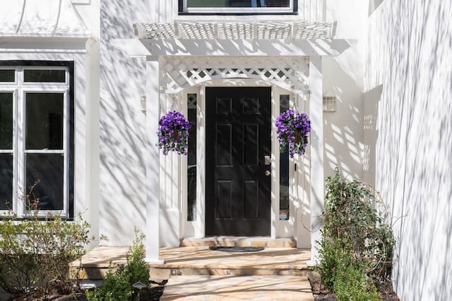 entrance to property featuring a pergola