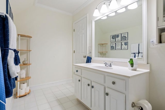 bathroom with tile patterned floors, baseboards, ornamental molding, and vanity