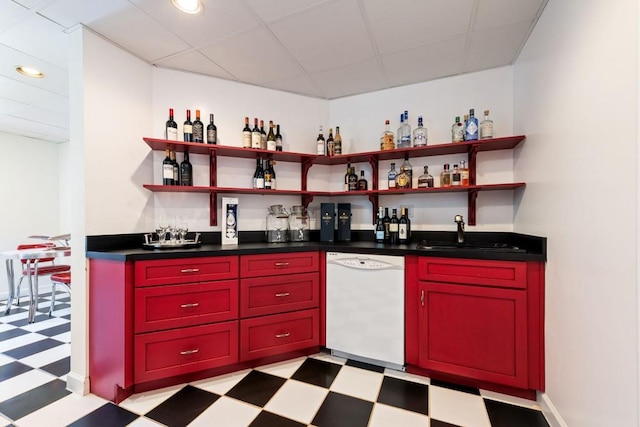 bar with indoor bar, dishwasher, and light floors