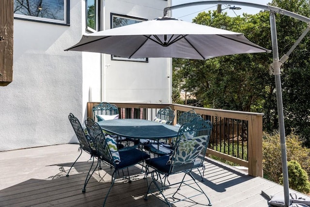 deck featuring outdoor dining area