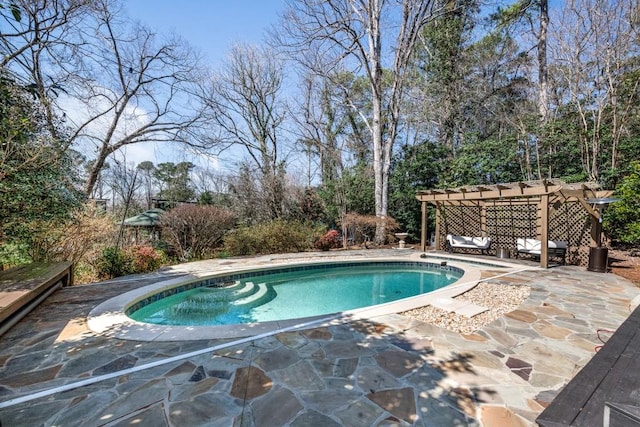 view of pool with a fenced in pool, a pergola, and a patio