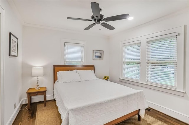 728 Antone St NW, Atlanta, GA 30318 - bedroom with wood finished floors, ornamental molding, baseboards, and ceiling fan