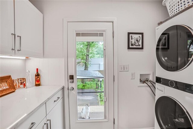 728 Antone St NW, Atlanta, GA 30318 - laundry room with stacked washing machine and dryer and cabinet space