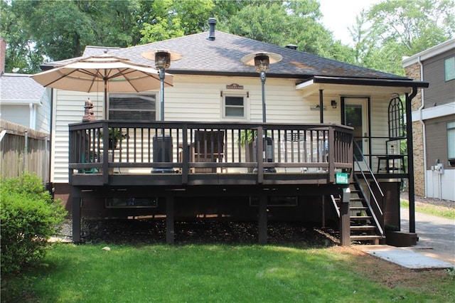 728 Antone St NW, Atlanta, GA 30318 - rear view of house featuring a shingled roof, a wooden deck, a lawn, and stairs