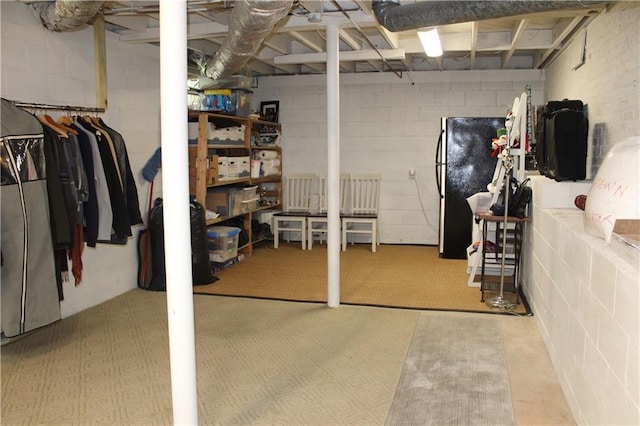 728 Antone St NW, Atlanta, GA 30318 - unfinished basement with freestanding refrigerator and concrete block wall