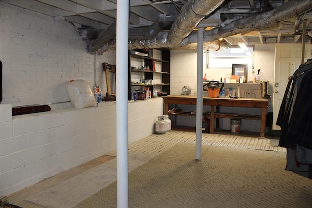 728 Antone St NW, Atlanta, GA 30318 - unfinished below grade area featuring a workshop area and concrete block wall