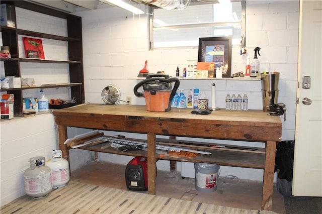 728 Antone St NW, Atlanta, GA 30318 - unfinished below grade area featuring a workshop area and concrete block wall