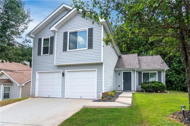 view of front of house with a front lawn and a garage