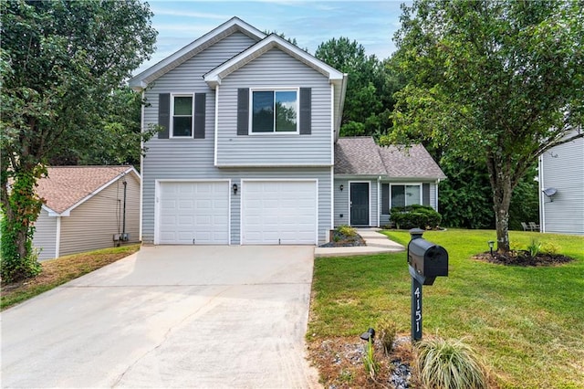 view of front of home with a front lawn and a garage