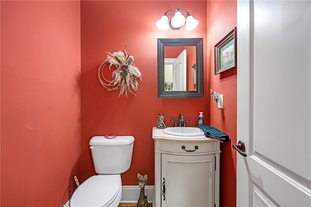 bathroom with toilet and vanity