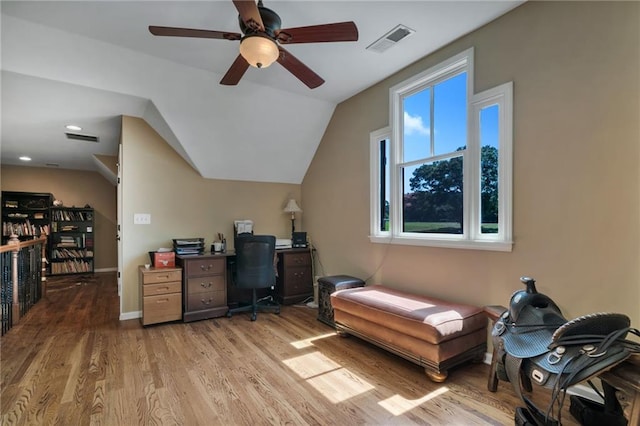 office space with light hardwood / wood-style floors, ceiling fan, and vaulted ceiling