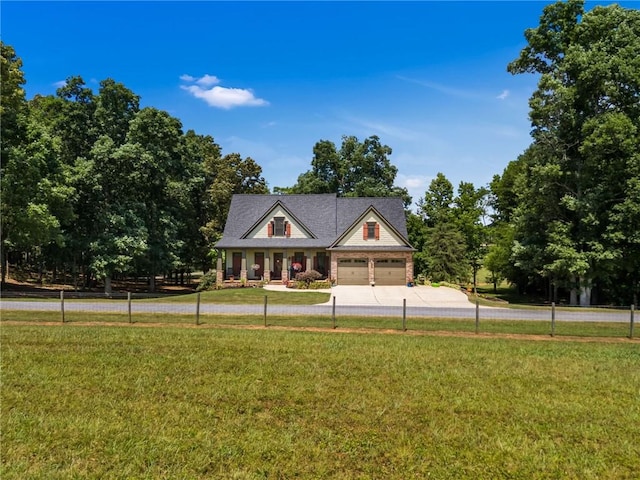 view of front of house with a garage and a front yard