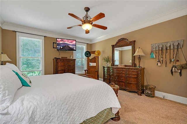 carpeted bedroom with ceiling fan and crown molding