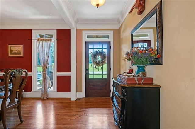 entrance foyer with hardwood / wood-style flooring, crown molding, and plenty of natural light