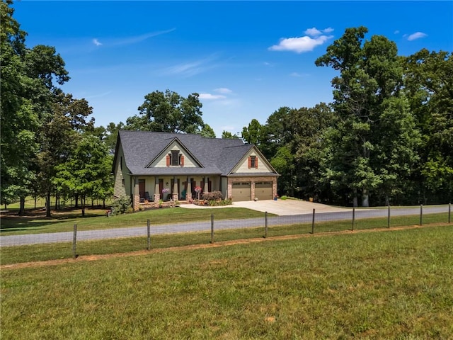 view of front facade with a garage, a front lawn, and a porch