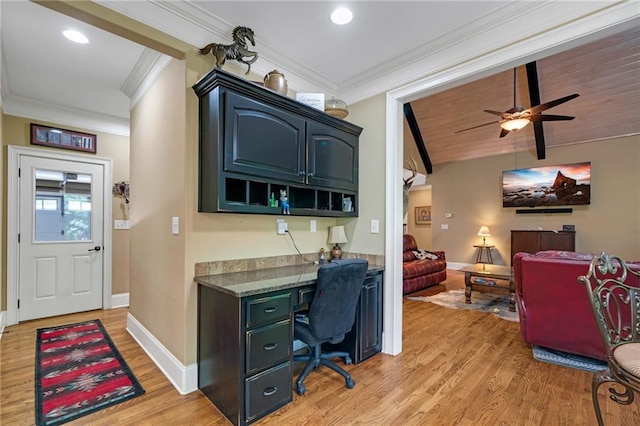 office featuring built in desk, ceiling fan, ornamental molding, and light hardwood / wood-style floors