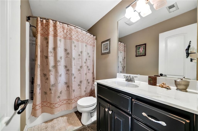 full bathroom with vanity, toilet, tile patterned floors, and shower / bath combo with shower curtain