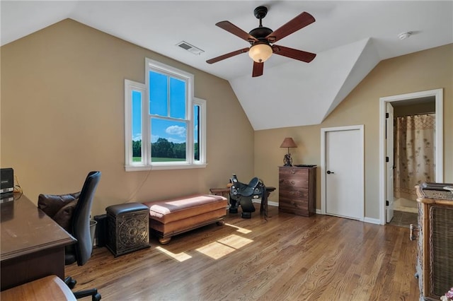 home office with wood-type flooring, ceiling fan, and lofted ceiling