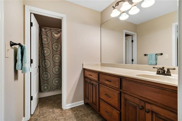 bathroom with vanity and an inviting chandelier