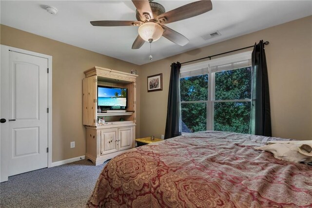 carpeted bedroom with ceiling fan