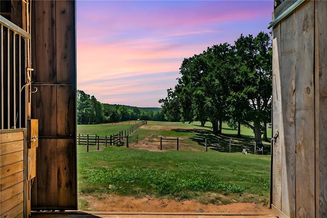 exterior space with a rural view and an outdoor structure