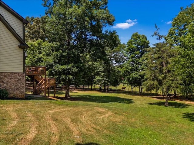 view of yard with a deck