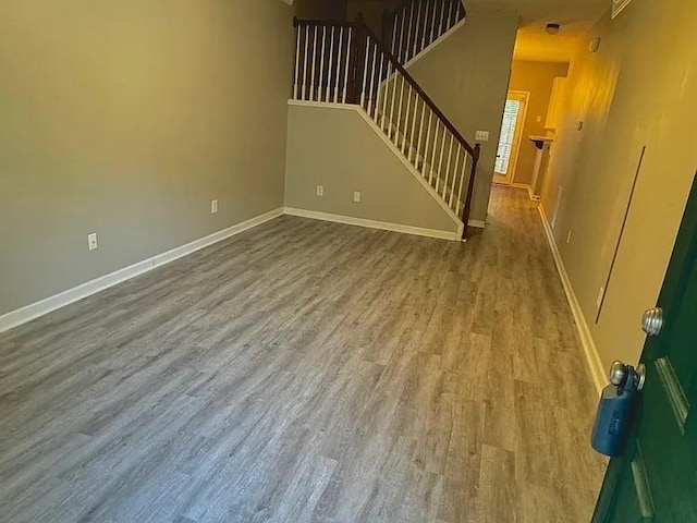 unfurnished living room with wood-type flooring