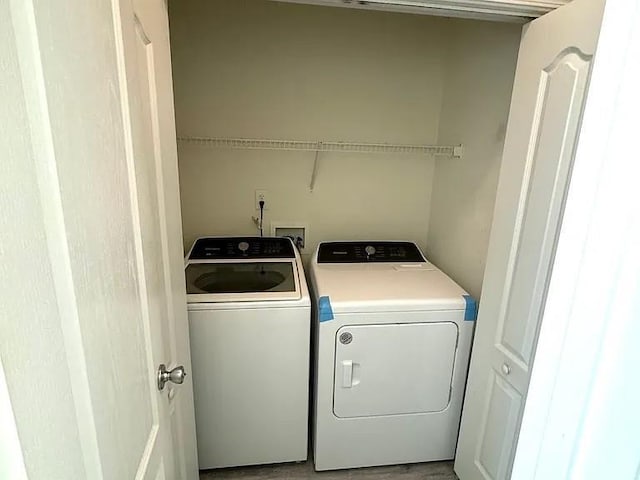 washroom with separate washer and dryer