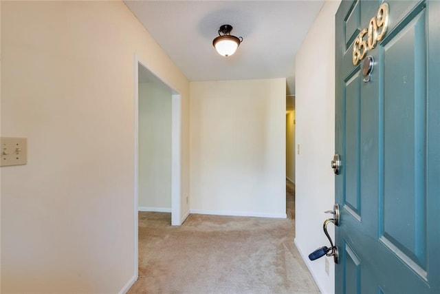 view of carpeted foyer