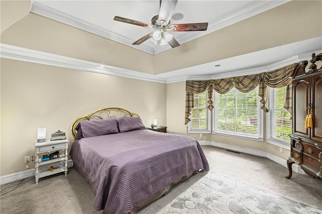 bedroom featuring a ceiling fan, visible vents, crown molding, light colored carpet, and baseboards