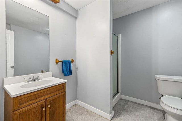 full bathroom with vanity, toilet, baseboards, tile patterned floors, and a stall shower