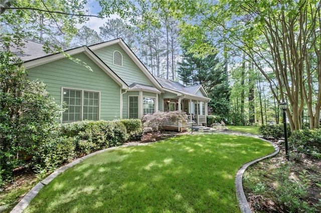 exterior space with a lawn and covered porch