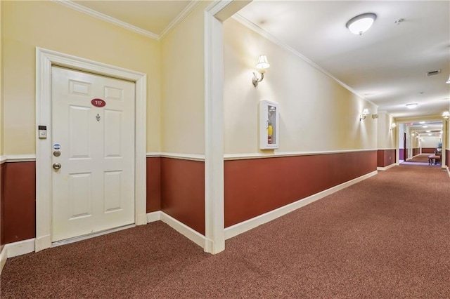 foyer featuring crown molding and carpet flooring