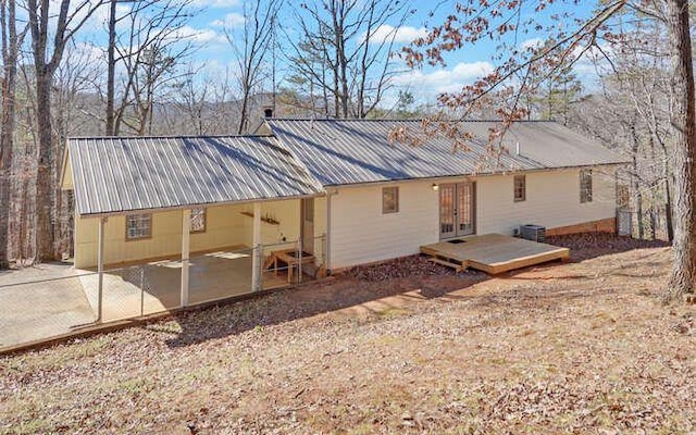 rear view of property featuring a patio and french doors