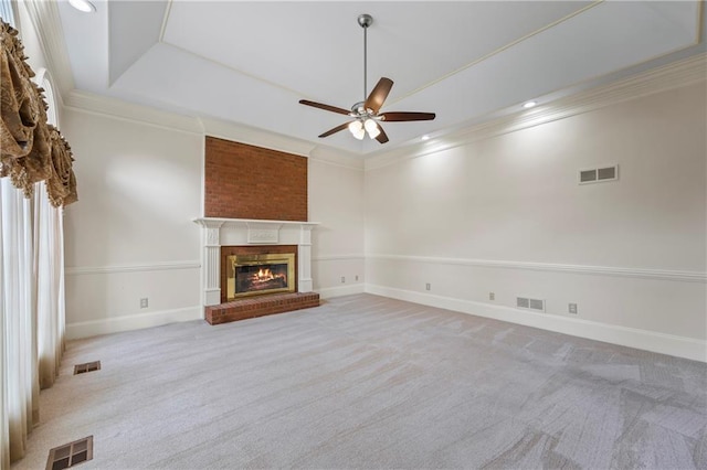 unfurnished living room with visible vents, carpet flooring, and ceiling fan