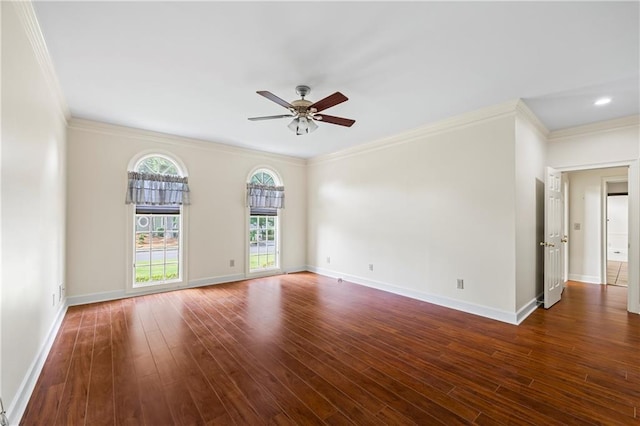 empty room featuring a ceiling fan, dark wood finished floors, and ornamental molding