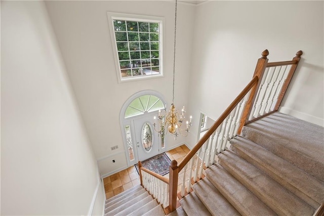 stairs with baseboards and a wealth of natural light