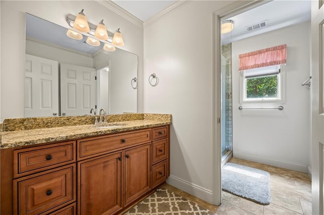 full bath featuring visible vents, ornamental molding, vanity, baseboards, and a shower with shower door