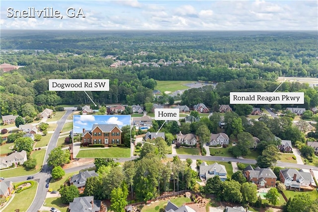 aerial view featuring a residential view and a view of trees