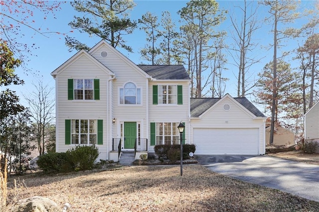 view of front of home with a garage and concrete driveway