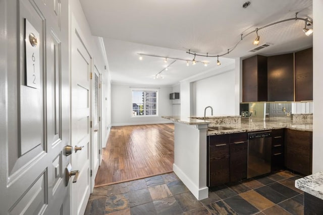 kitchen featuring dark hardwood / wood-style floors, sink, kitchen peninsula, dark brown cabinets, and dishwasher