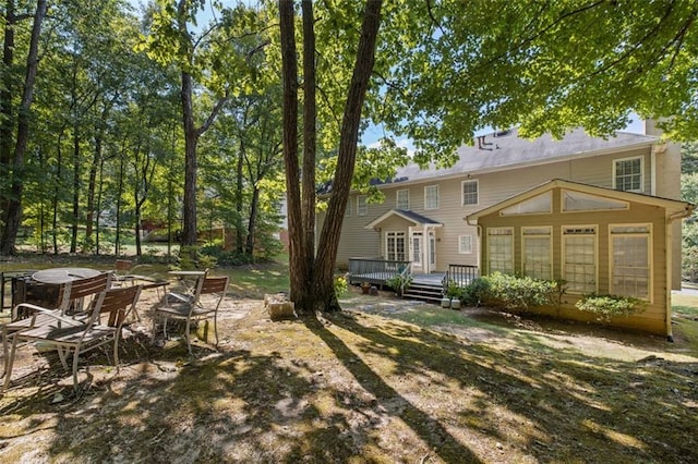 view of yard featuring a wooden deck