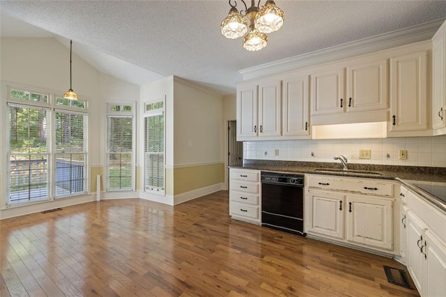 kitchen featuring hardwood / wood-style floors, tasteful backsplash, decorative light fixtures, vaulted ceiling, and black dishwasher