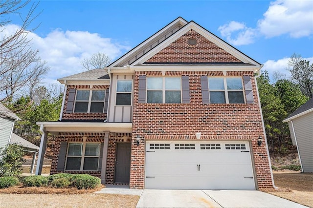 traditional home with driveway, brick siding, and an attached garage