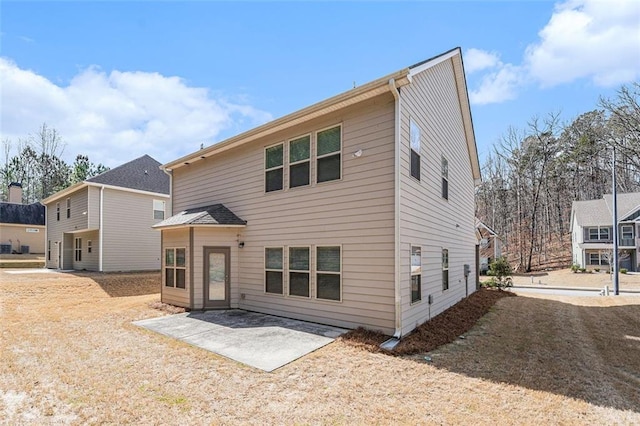 rear view of house featuring a patio