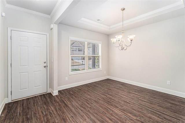 entrance foyer featuring baseboards, visible vents, ornamental molding, dark wood-style flooring, and a tray ceiling