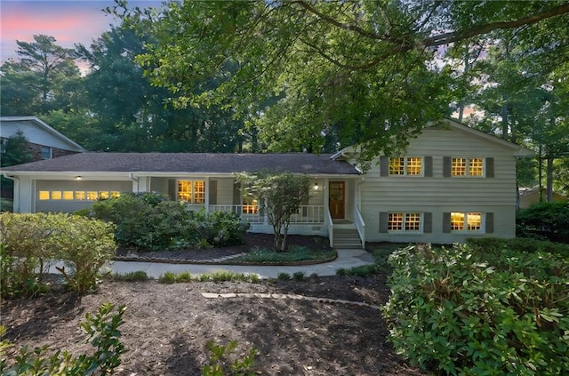 4669 Dunover Cir, Atlanta, GA 30360 - tri-level home featuring covered porch and a garage
