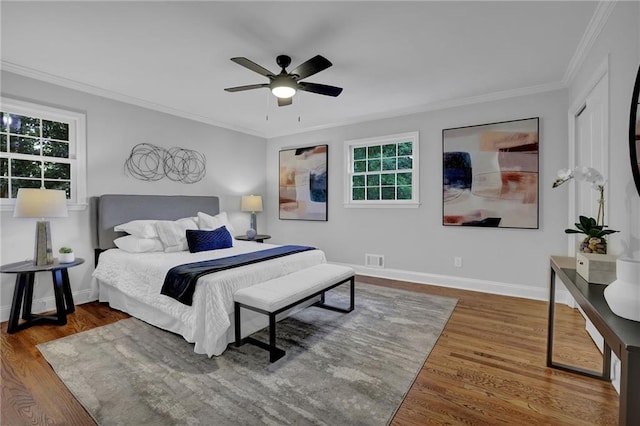 4669 Dunover Cir, Atlanta, GA 30360 - bedroom featuring ornamental molding, wood finished floors, multiple windows, and ceiling fan